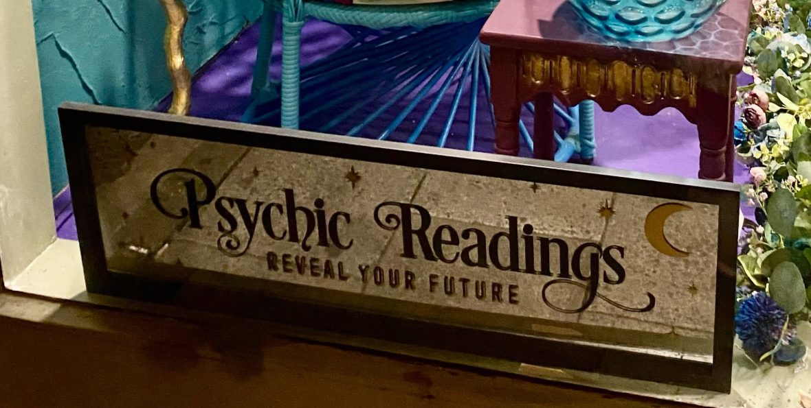 Psychic readings sign in The Peacock Emporium window